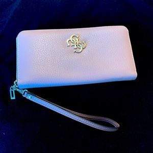 Pink Guess Wristlet wallet.